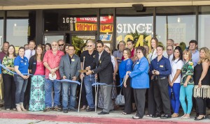 Andy Maredia, Dickey’s Barbecue Pit owner, center, cut two ceremonial ribbons Thursday for the Nederland and Port Arthur Chambers of Commerce during the grand opening ceremony for Dickey’s new location off Hwy 69 in Nederland, across from Central Mall in Port Arthur.