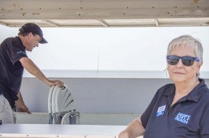 Site Coordinator Mike Guzman, left, and Media Coordinator Vickie Cleveland pack up the registration and information booth toward the tail end of the Adopt-A-Beach fall cleanup Saturday morning at McFaddin Beach in Sabine Pass.