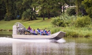 Visitors take to the Trinity River Delta Marsh in one of the first airboat rides for Texas Gatorfest 2015 in Anahuac Friday night.
