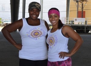 Kisha Simmons Proctor, left, and Genese Galvan, owners of E3Retreats, pose for a quick photo before a family fitness day at the pavilion in Port Arthur on Saturday. Mary Meaux/The News 