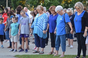 Crowds hold hands and pray during See You At the Station in Port Neches on Wednesday. Mary Meaux/The News