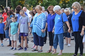 Crowds hold hands and pray during See You At the Station in Port Neches on Wednesday. Mary Meaux/The News 