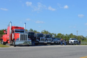 Local tow truck drivers line the roadway along Texas 73 west of Taylor Bayou Bridge reminding motorists to slow down and move over on Wednesday. Mary Meaux/The News 