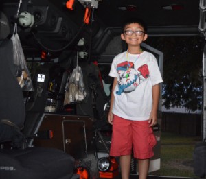 Ryan Pham, 9, of Groves, gets a tour inside of a fire engine during Groves Fire Department’s Open House on Wednesday. Mary Meaux/The News