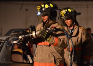 Groves firefighters use the Jaws of Life in a extrication demonstration during open house at Groves Fire Department on Wednesday. Mary Meaux/The News 