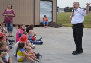 Port Neches Fire Chief Steve Curran speaks to families prior to a residential sprinkler and smoke alarm live burn demonstration during the department’s open house on Thursday. Mary Meaux/The News 