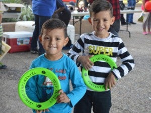 Brothers Daniel Vargas, 4, left, and Christopher Vargas, pose for a photo during a Port Arthur fire prevention week event at the Robert A. “Bob” Bowers Civic Center on Monday. Mary Meaux/The News 