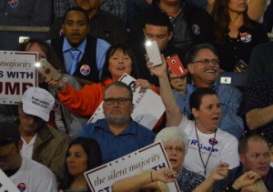The crowd breaks out their cell phone lights to the song “Hey Jude” while waiting on Trump’s arrival. Mary Meaux/The News