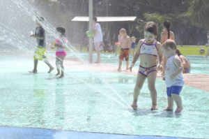 Peyton Howell, 3 1/2, and her little brother Easton Howell, 1 1/2, of Georgia, have fun at the Groves Splash Park. The HowellÕs were in town for the graduation of a relative.
