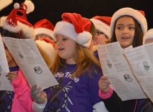 Students bring holiday cheer during An Old Fashioned Christmas in Groves.  Mary Meaux/The News
