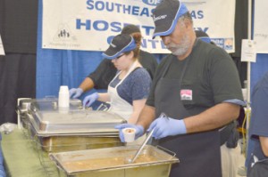 Michael Bowser, with the Hospitality CenterÕs booth, fills a sample cup with gumbo at the Rotary Club of Port ArthurÕs Annual "Taste of Gumbo, Etc." on Saturday at the Robert A. "Bob"Bowers Civic Center.