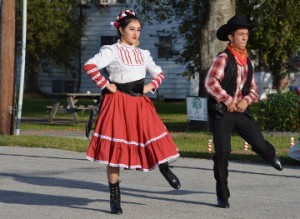 Members of the Mexican Heritage Folkloric Dancers perform during Christmas on the Avenue in Nederland on Saturday. Mary Meaux/The News