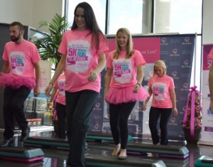 Philpott Motors employee Deanna Miller, second from left, steps up to cancer on Tuesday. Mary Meaux/The News