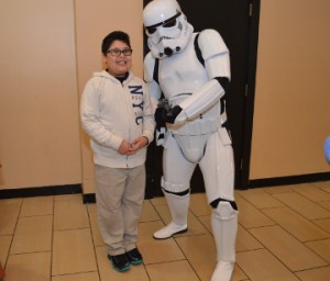 Kristofer Camacho, 9, of Nederland poses for a photo with a Storm Trooper at Central Mall on Friday. The Star Wars characters were on hand Friday for the Star Wars: The Force Awakens movie premier. Mary Meaux/The News