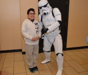 Kristofer Camacho, 9, of Nederland poses for a photo with a Storm Trooper at Central Mall on Friday. The Star Wars characters were on hand Friday for the Star Wars: The Force Awakens movie premier. Mary Meaux/The News 