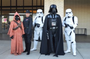 Licensed Star Wars characters were on hand to pose for photos with movie-goers and fans for the Star Wars: The Force Awakens movie premier at Central Mall on Friday. Mary Meaux/The News 