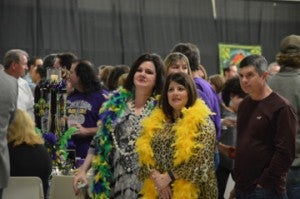 Mardi Gras revelers watching the fun during Beans and Jeans at the Robert A. “Bob” Bowers Civic Center on Saturday. Mary Meaux/The News 