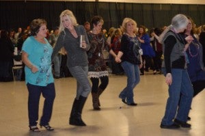 Fans get to their feet and dance to Second Line during Beans and Jeans at the Robert A. “Bob” Bowers Civic Center on Saturday. Mary Meaux/The News 