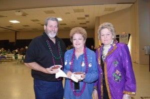 Joey and Linda Hebert, from left, and Sharon Schleiffer pose for a photo during Beans and Jeans at the Robert A. “Bob” Bowers Civic Center on Saturday. Mary Meaux/The News 