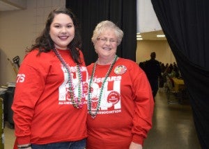 Natalie Collazo, left, and her mother Christine Collazo support the Red Hussars Alumni Association during Beans and Jeans at the Robert A. “Bob” Bowers Civic Center on Saturday. Mary Meaux/The News 