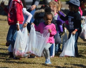 Brooklyn Brown, 3, searches for candy during Easter in January Candy Drop at Memorial Baptist Church on Saturday. Mary Meaux/The News 