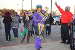 Amanda Smith with Lamar State College-Port Arthur gets ready to celebrate at a Mardi Gras Kick-off Party outside the Carl Parker Center in Port Arthur on Thursday. Mary Meaux/The News 
