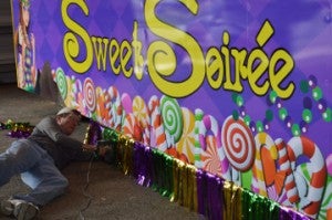 Danny Walker with the Majestic Krewe of Aurora puts finishing touches to his float in the Aurora Building in downtown Port Arthur on Wednesday. Mary Meaux/The News 