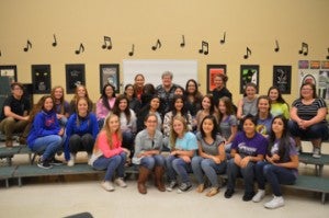 Kathy Hollier, choir director at Groves Middle School, poses for a photo with some of her students. Mary Meaux/The News