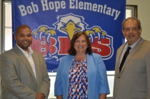 Port Arthur Mayor Derrick Freeman, left, Bob Hope Elementary School Campus Director Virginia Roberts and Bob Hope School Superintendent Bobby Lopez pose for a quick photo during a ribbon cutting for the new elementary school campus on Monday.  Mary Meaux/The News