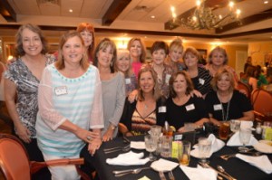 Former Westernaires Director Beverly Minaldi joins in for a photo with members of the dance/drill team 1973-1974, Pat Feldschau, Tonya Mitchell, Rhonda Stephens, Vicki Calloway, Debra Stukey, Gail Maxwell Foreman, Sheila Taylor, Connie Safer, Katherine Streetman Richardson, Donna Foust Roberts, Donna Ellerbee Jorgensen and Casey Mallett during a luncheon honoring the 60th anniversary of the group at the Pompano Club in Port Neches on Saturday. Mary Meaux/The News
