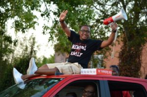 Representatives of the first graduating class of Memorial High School, 2003, were on hand to cheer on the Titans during the Memorial High School Homecoming Parade on Wednesday. Mary Meaux/The News