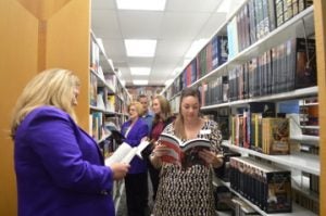 Members of the Port Neches Chamber of Commerce browse through the aisles during the ribbon cutting for Fleur Fine Books on Wednesday. Mary Meaux/The News