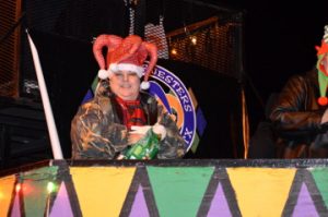 Members of the Krewe of Jesters show their holiday spirit during the Port Arthur’s Annual Cultural Lighted Christmas Parade on Procter Street on Friday. Mary Meaux/The News