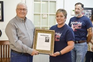 Don Albanese is named 2017 Mr. Nederland and given a plaque by NHF Executive Director Shannon Hemby. (Lorenzo Salinas/The News)