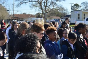 Attendees bow their heads in prayer at the Sam Houston Elementary Groundbreaking in Port Arthur. (Lorenzo Salinas/The News)