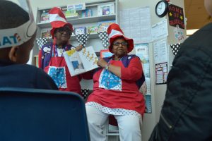 One of the AARP Experience Corps tutors reads a selection from Dr. Seuss to DeQueen students in “The Nook” room at DeQueen Elementary. (Lorenzo Salinas/The News)
